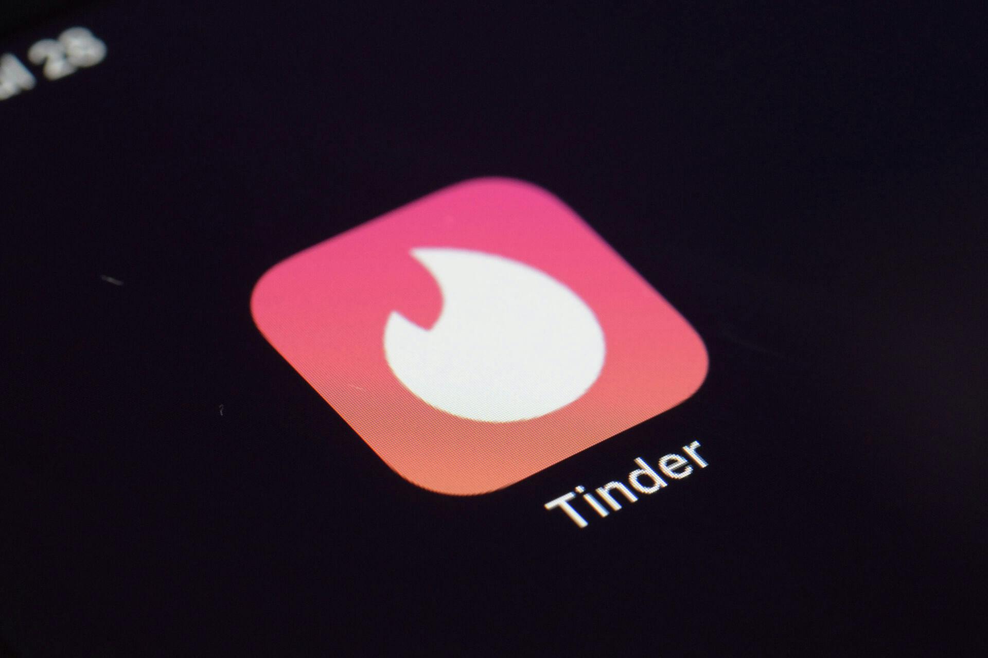FILE - The icon for the dating app Tinder appears on a device, July 28, 2020, in New York. (AP Photo/Patrick Sison, File)