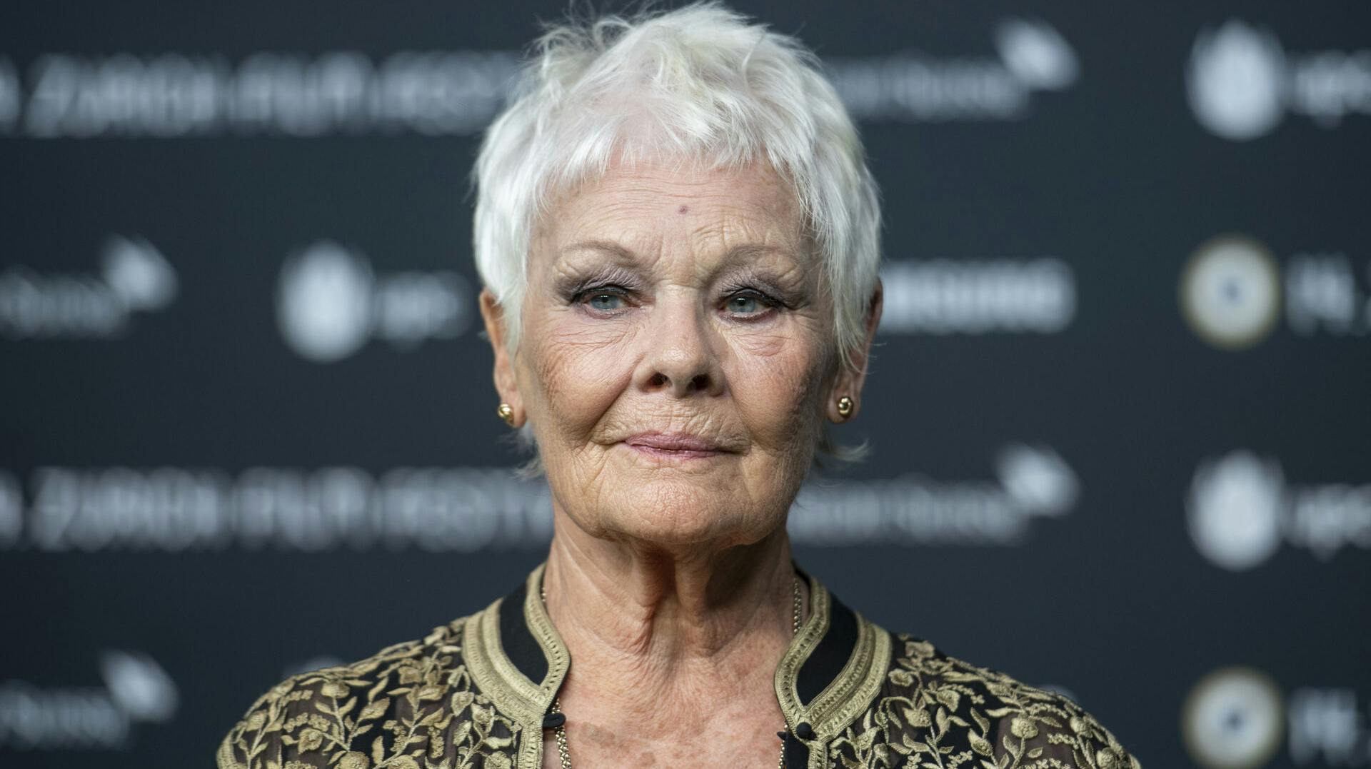 FILE - British actress Judi Dench poses on the Green Carpet before the screening of the movie "Red Joan" at the 14th Zurich Film Festival (ZFF) in Zurich, Switzerland, Wednesday, Oct. 3, 2018. (Patrick Huerlimann/Keystone via AP, File)