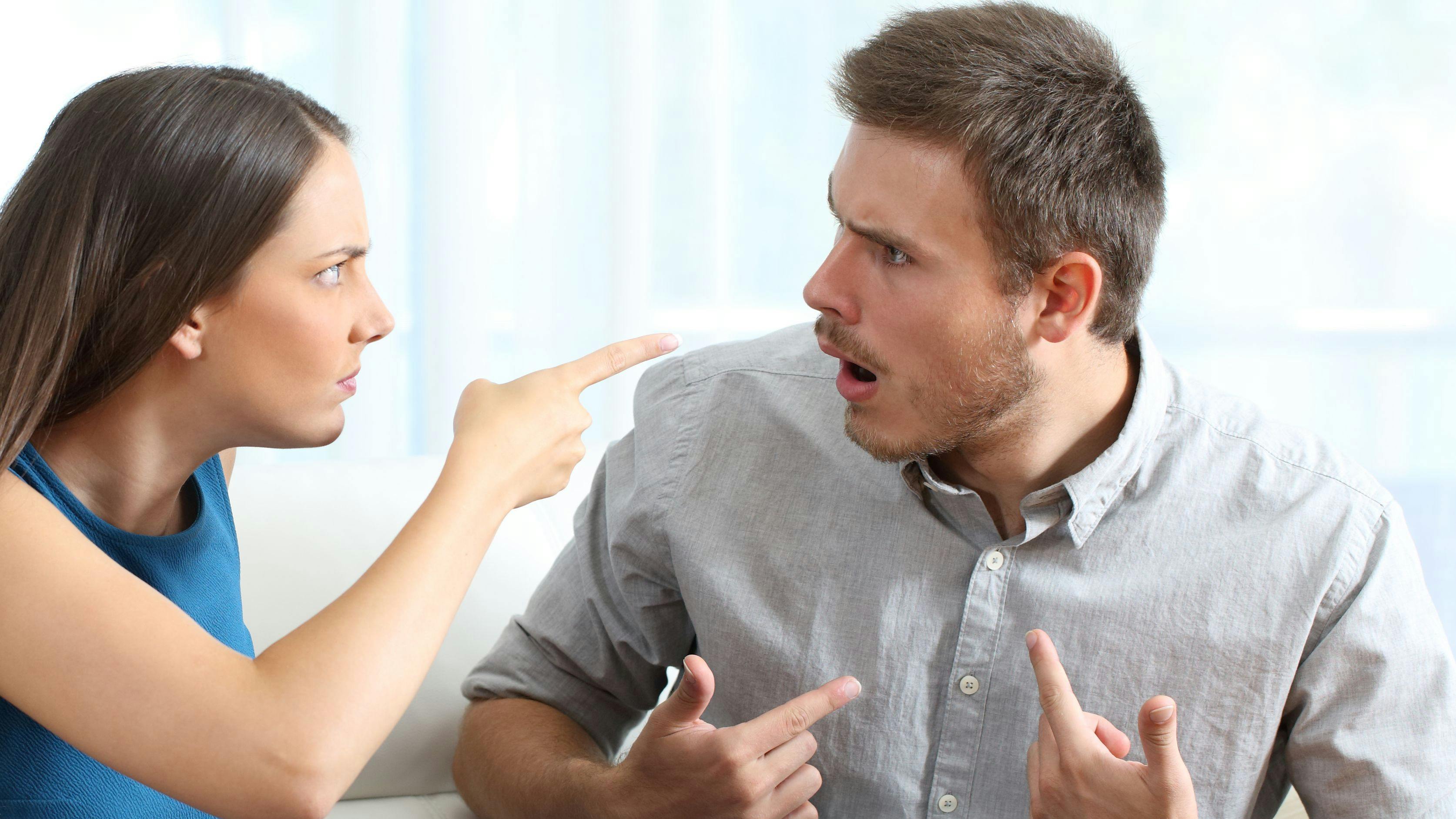 Marriage accusing during a couple therapy sitting on a couch at home or consultation