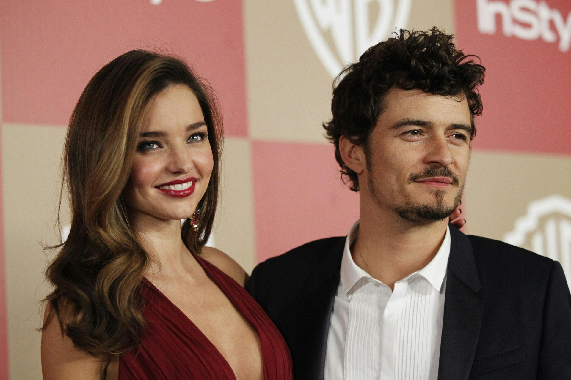 Actor Orlando Bloom (R) and model Miranda Kerr pose at the InStyle/Warner Bros. after party following the 70th annual Golden Globe Awards in Beverly Hills, California in this January 13, 2013, file photo. Bloom and Kerr have separated after three years of marriage, the couple said on October 25, 2013. REUTERS/Mario Anzuoni/Files (UNITED STATES - Tags: ENTERTAINMENT)