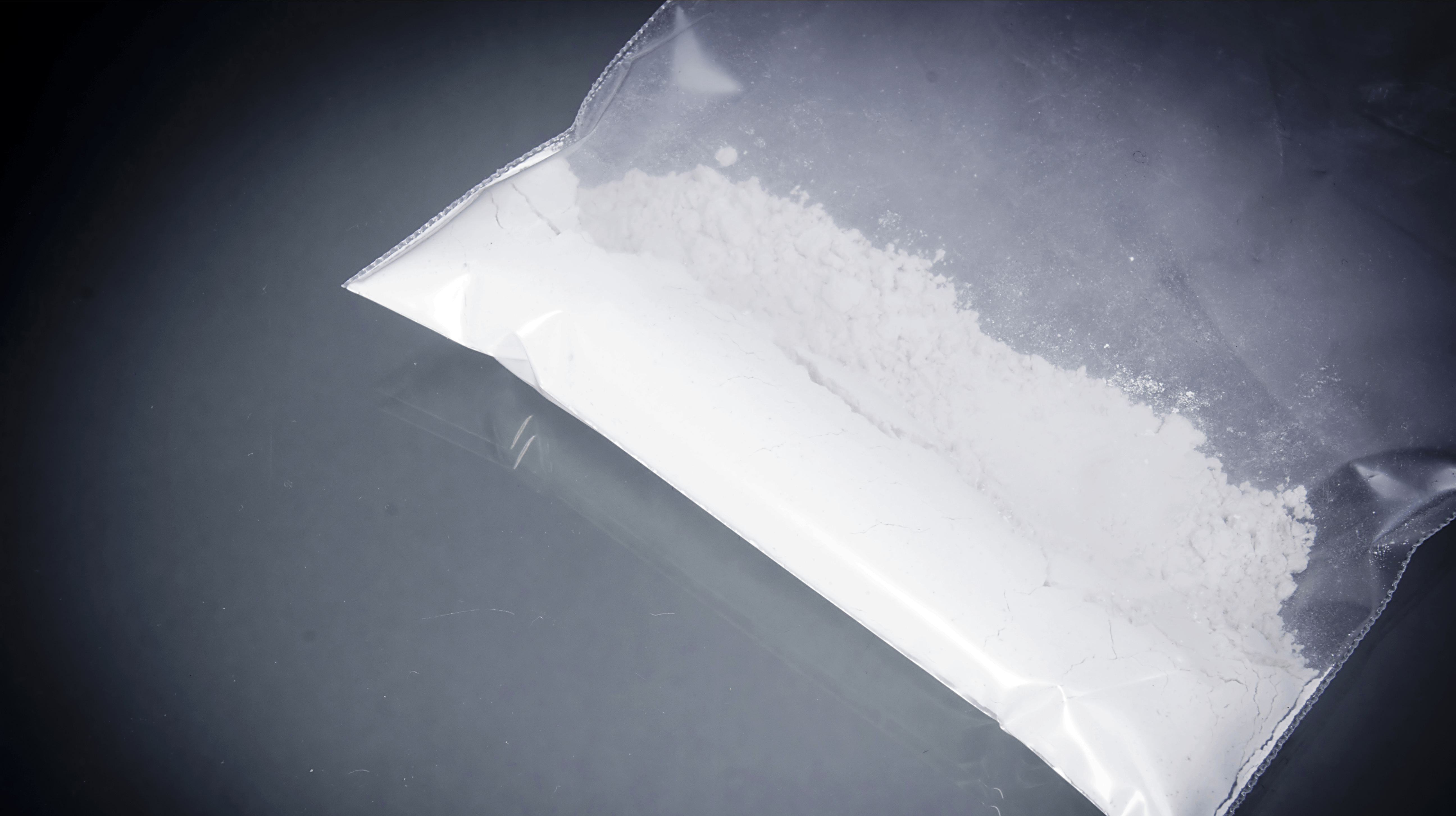 Cocaine drug in resealable packaging on a black background