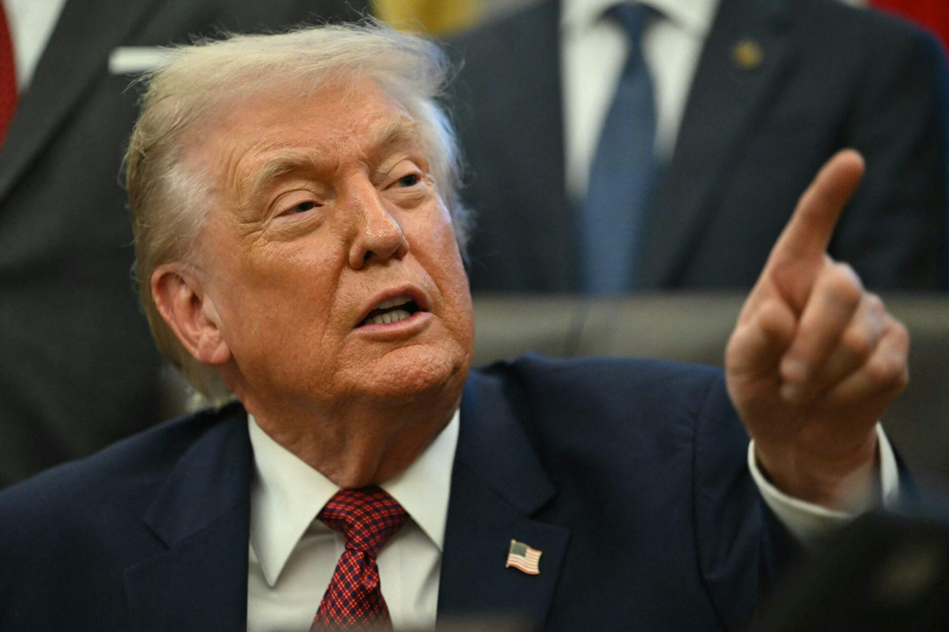 US President Donald Trump makes an announcement from the Oval Office of the White House in Washington, DC on December 3, 2025. President Trump announced weaker fuel efficiency standards for the country, as part of his agenda to lower the price of gasoline-powered cars. (Photo by ANDREW CABALLERO-REYNOLDS / AFP)