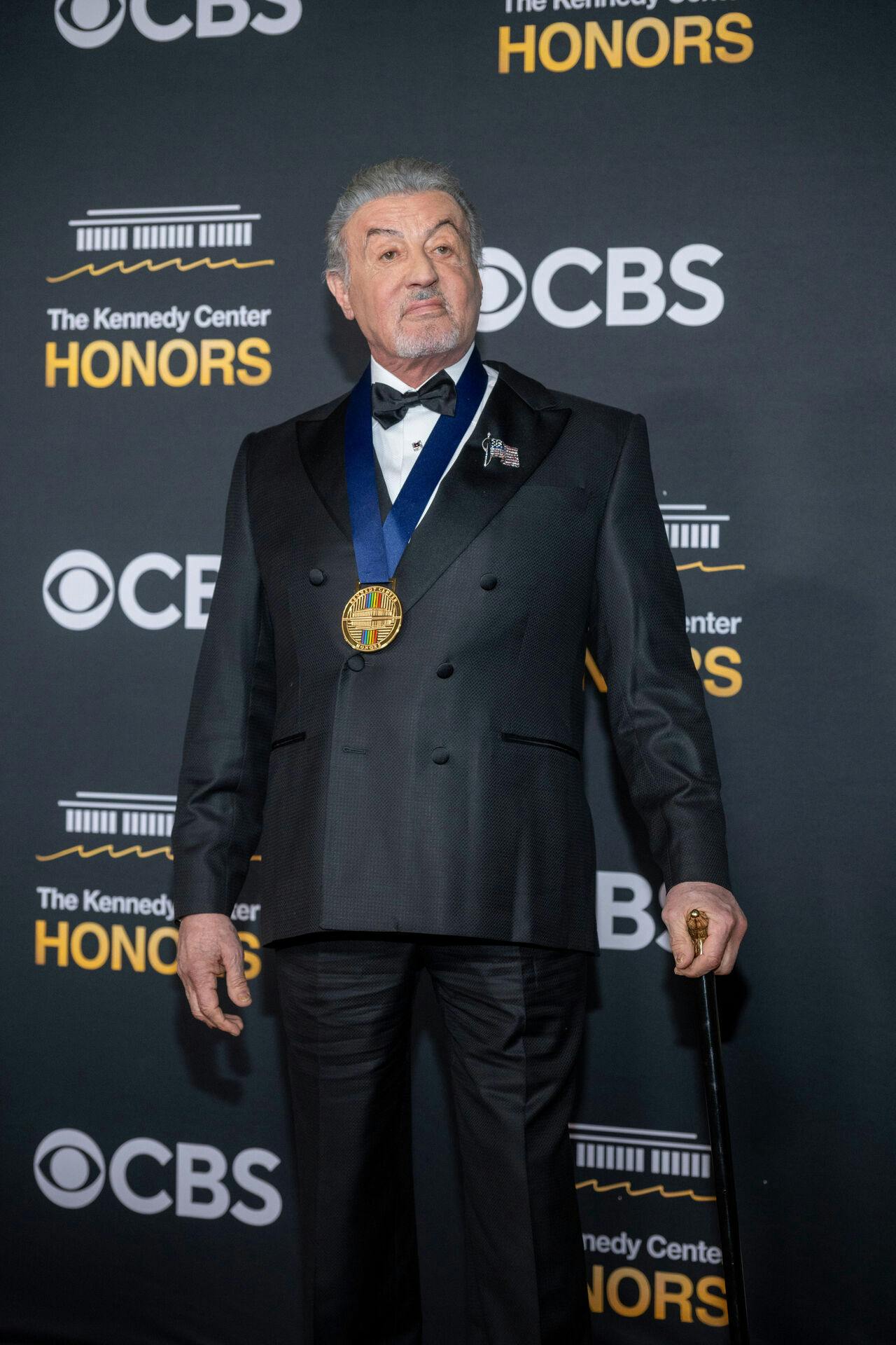 2025 Kennedy Center Honoree Sylvester Stallone arrives on the red carpet for the 48th Kennedy Center Honors at the Kennedy Center for the Performing Arts, Sunday, Dec. 7, 2025 in Washington. (AP Photo/Kevin Wolf)