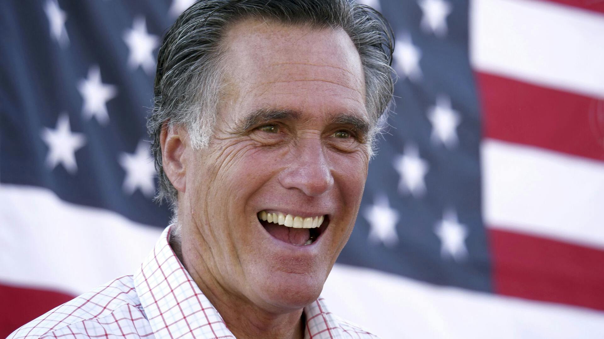 FILE - Mitt Romney smiles during a campaign event, June 20, 2018, in American Fork, Utah. (AP Photo/Rick Bowmer, File)
