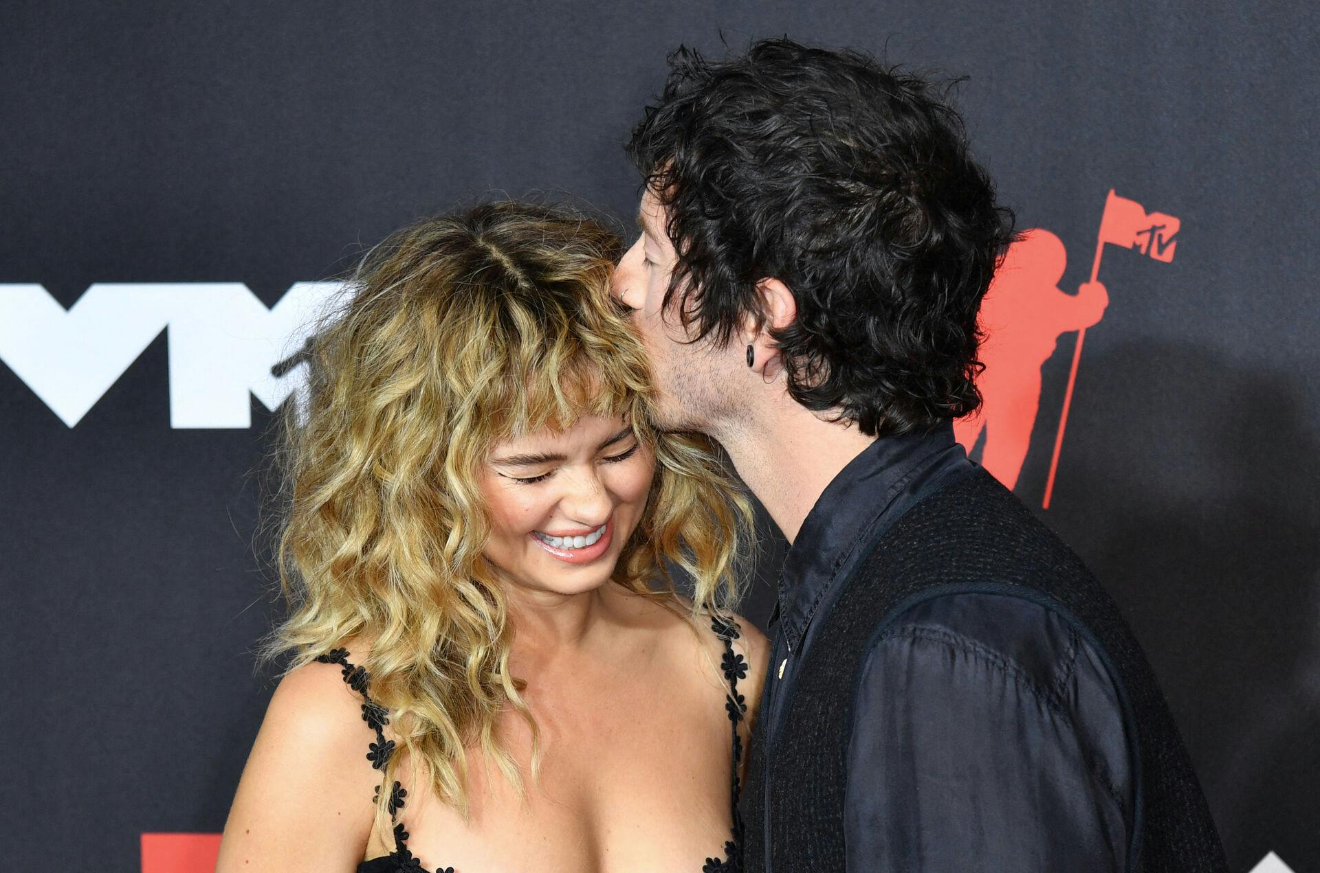 Drummer Josh Dun of Twenty One Pilots and his wife actress Debby Ryan arrive for the 2021 MTV Video Music Awards at Barclays Center in Brooklyn, New York, September 12, 2021. ANGELA WEISS / AFP
