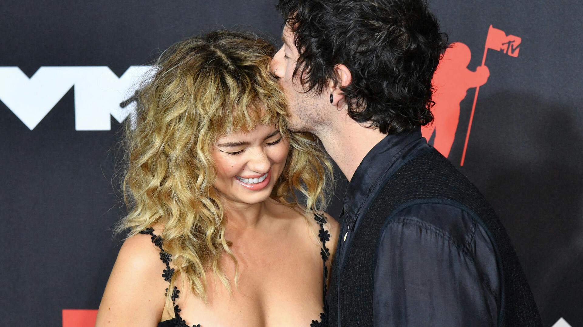 Drummer Josh Dun of Twenty One Pilots and his wife actress Debby Ryan arrive for the 2021 MTV Video Music Awards at Barclays Center in Brooklyn, New York, September 12, 2021. ANGELA WEISS / AFP
