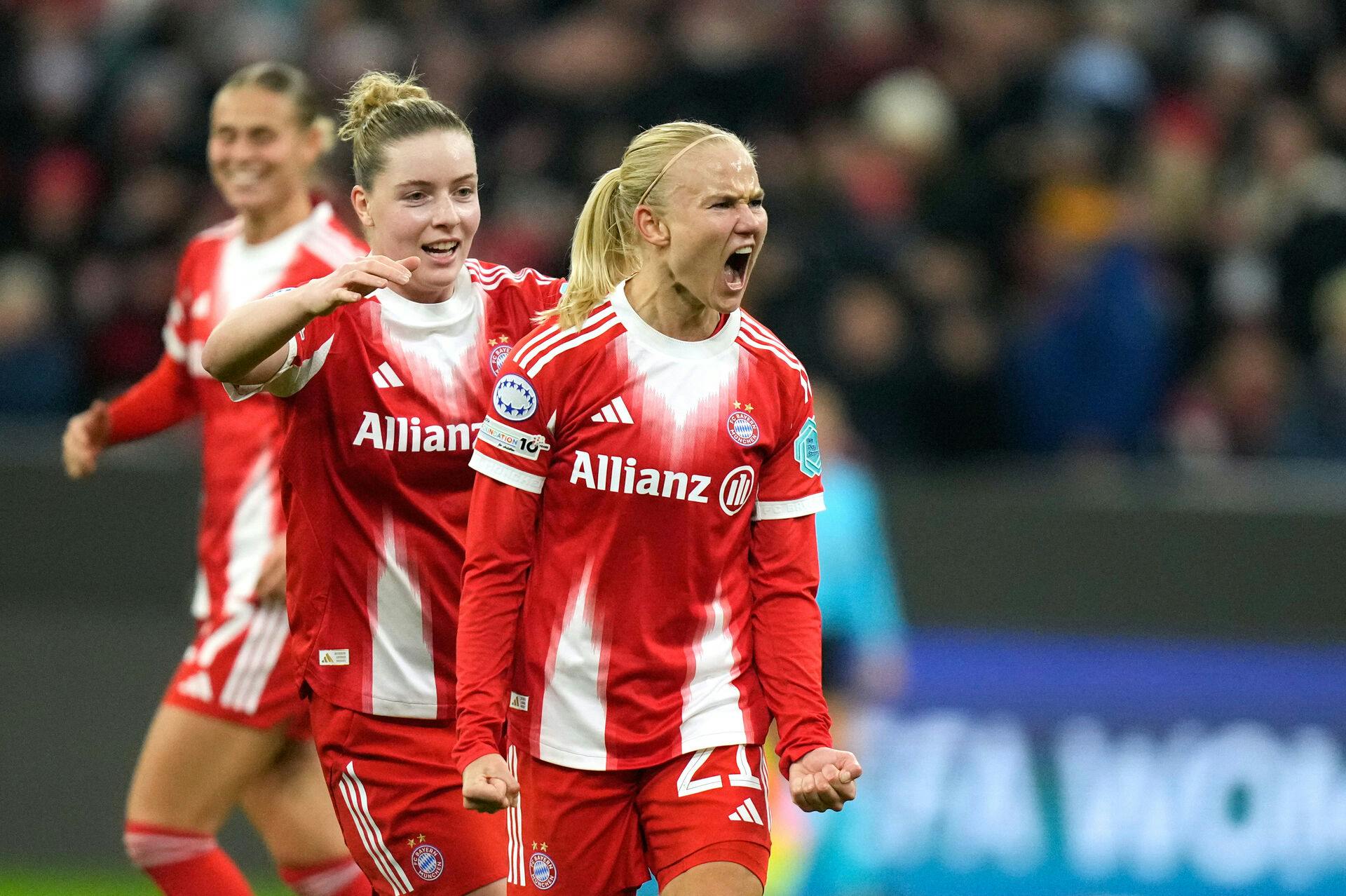 Bayern's Pernille Harder, right, reacts after scoring her side's second goal during the women's Champions League opening phase soccer match between FC Bayern Munich and Arsenal FC in Munich, Germany, Wednesday, Nov. 12, 2025. (AP Photo/Matthias Schrader)