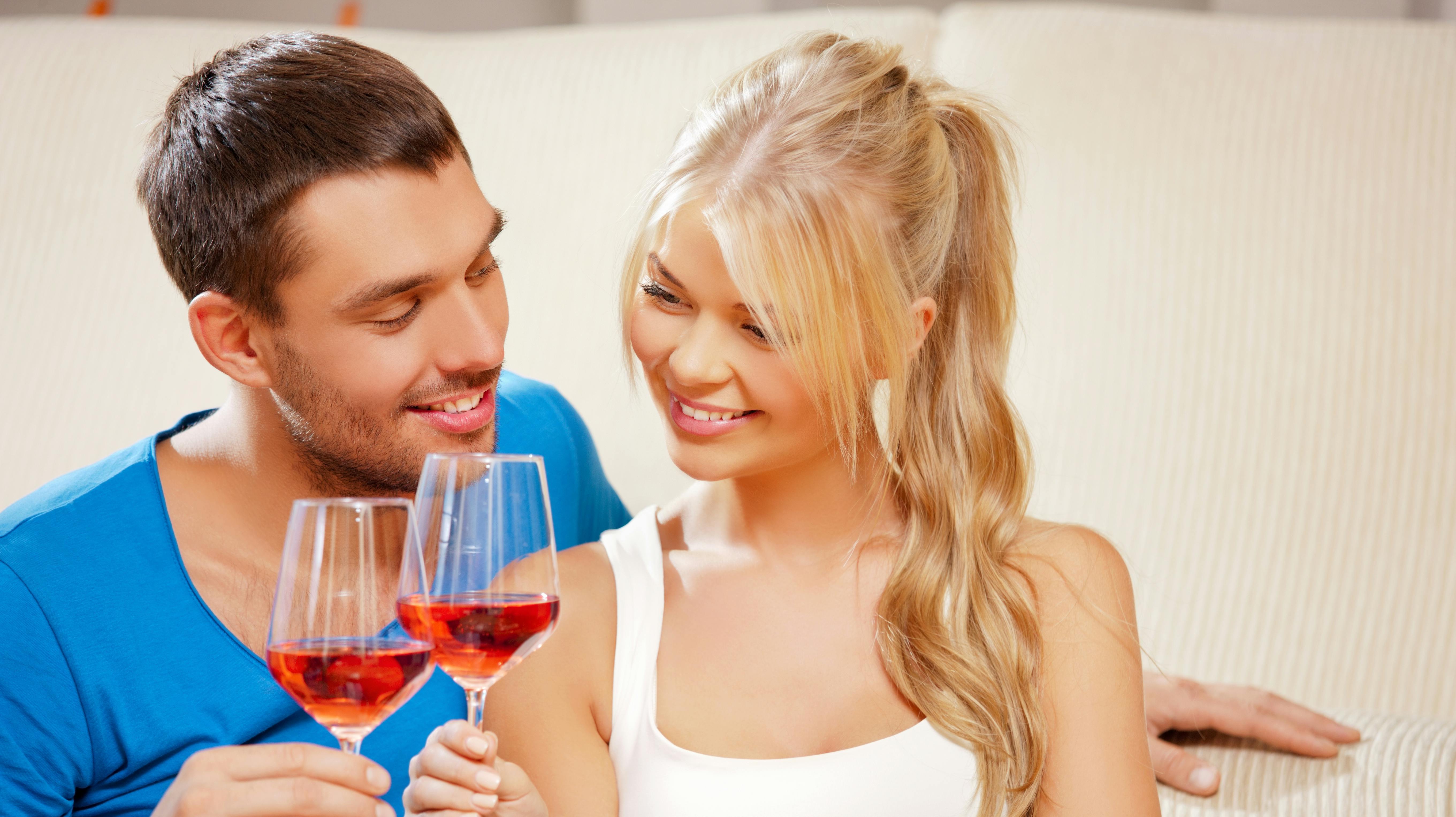 picture of happy romantic couple drinking wine