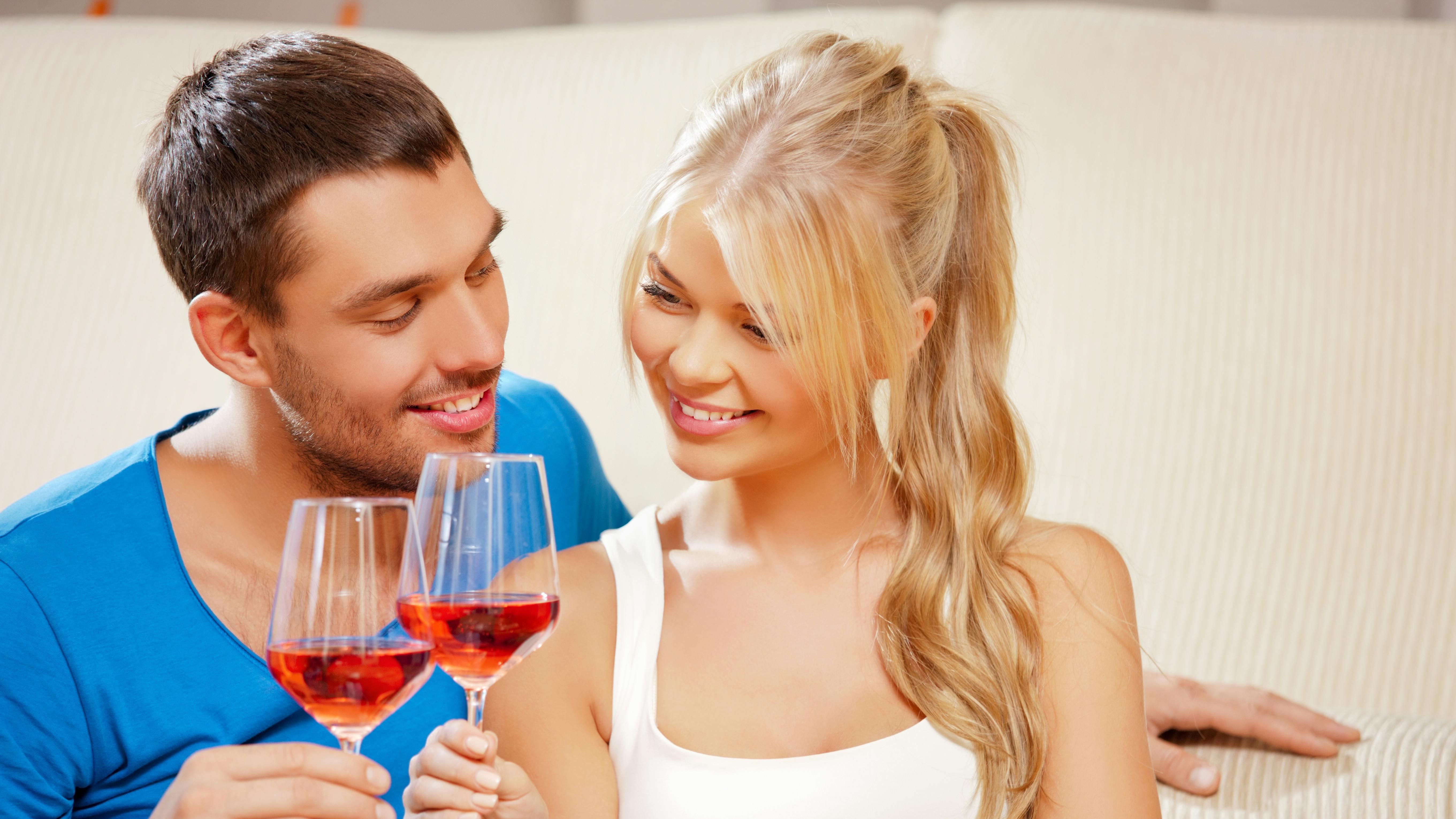 picture of happy romantic couple drinking wine
