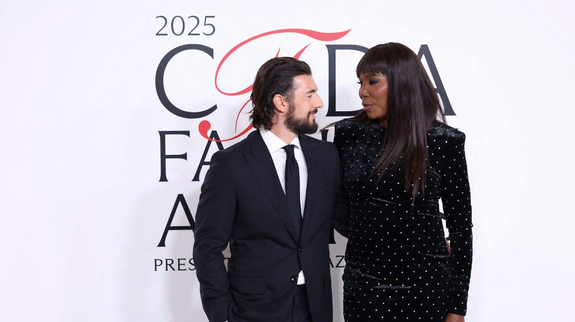 US tennis player Venus Williams (R) and fiancé Andrea Preti attends the CFDA (Council of Fashion Designers of America) Fashion Awards at the American Museum of Natural History in New York on November 3, 2025. (Photo by CHARLY TRIBALLEAU / AFP)