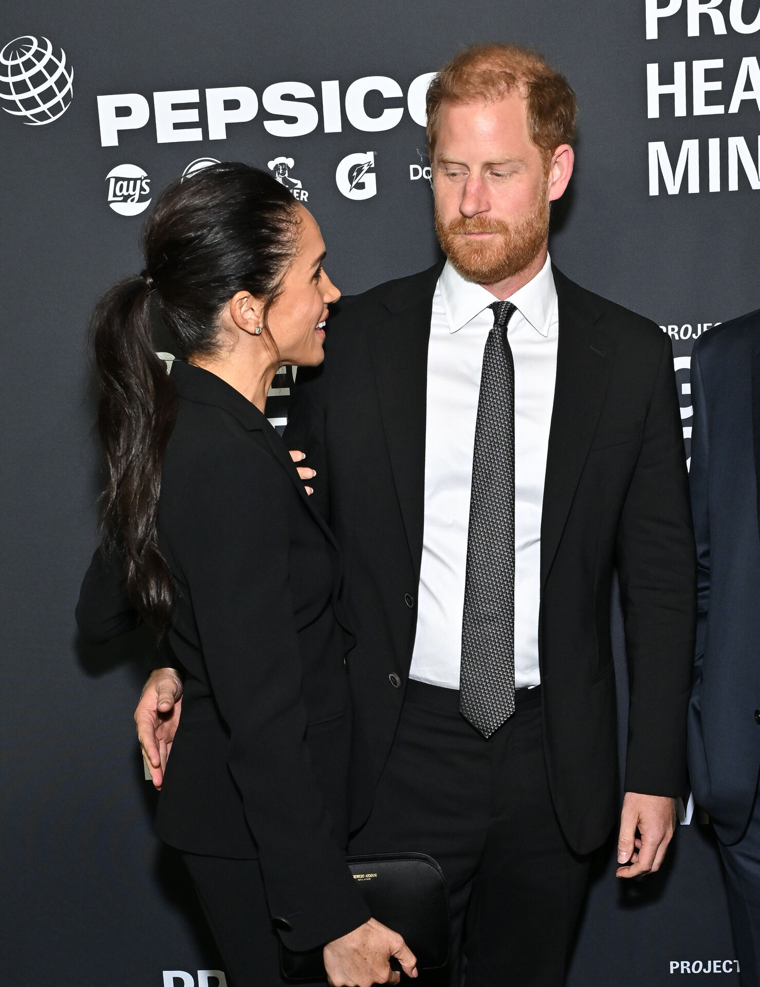 Meghan Markle, left, and Prince Harry, The Duke and Duchess of Sussex, attend the third annual World Mental Health Day Gala, hosted by Project Healthy Minds, at Spring Studios on Thursday, Oct. 9, 2025, in New York. (Photo by Evan Agostini/Invision/AP)