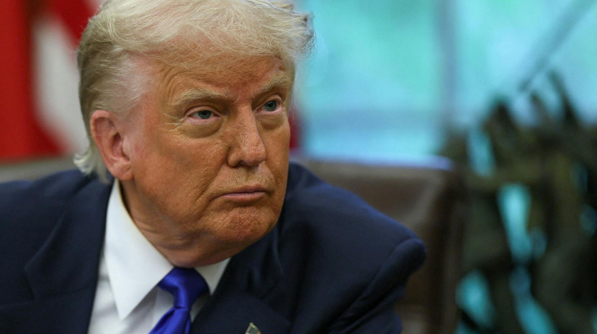FILE PHOTO: U.S. President Donald Trump looks on as he signs executive orders and proclamations in the Oval Office at the White House, in Washington, D.C., U.S., May 5, 2025. REUTERS/Leah Millis/File Photo
