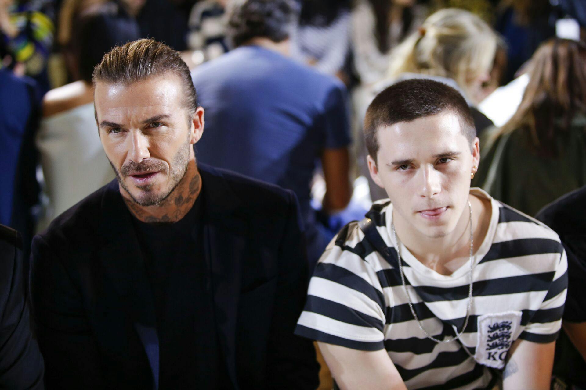 David Beckham and his son Brooklyn Beckham attend the Victoria Beckham SS18 show during New York Fashion Week on September 10, 2017 in New York. / AFP PHOTO / EDUARDO MUNOZ ALVAREZ