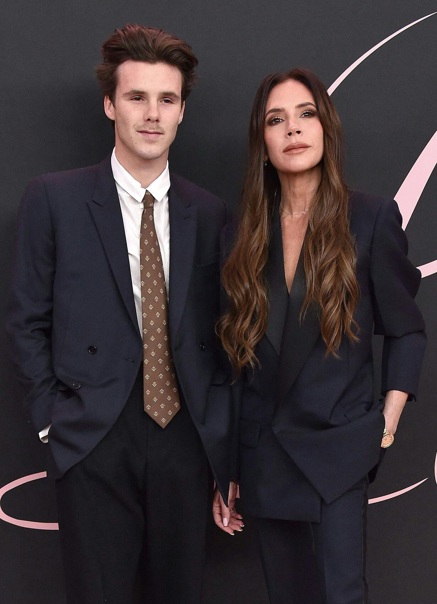 English fashion designer and singer Victoria Beckham and her son singer Cruz Beckham arrive for the Premiere of the movie 'Lola' at the Bruin theatre, in Los Angeles, on February 3, 2024. (Photo by LISA O'CONNOR / AFP)