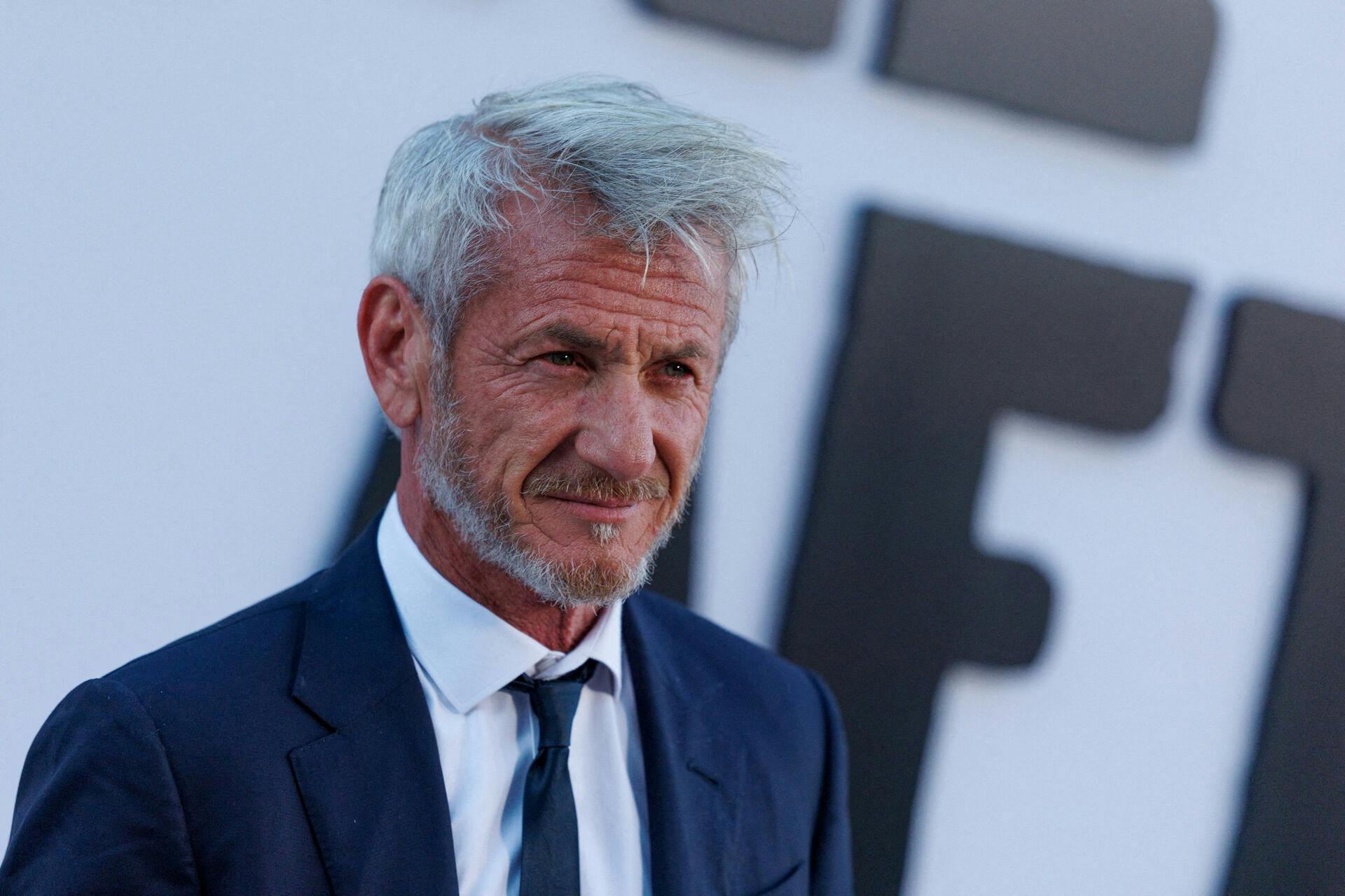 FILE PHOTO: Cast member Sean Penn poses on the red carpet for the world premiere of the film "One Battle After Another" in the Hollywood neighborhood of Los Angeles, California, U.S., September 8, 2025. REUTERS/Mike Blake/File Photo