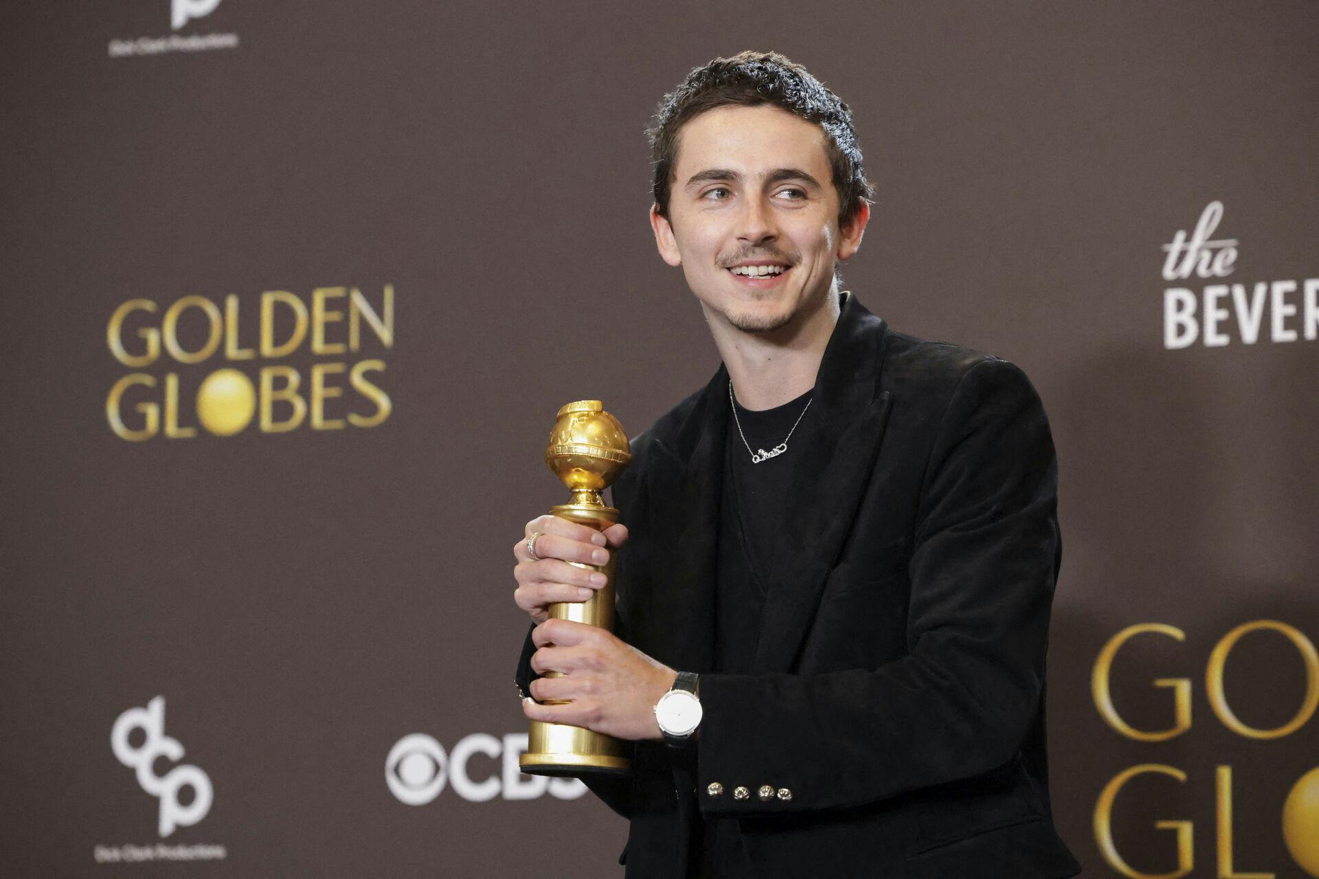 Timothee Chalamet poses with the Best Performance by a Male Actor in a Motion Picture - Musical or Comedy award for "Marty Supreme" at the 83rd Annual Golden Globes in Beverly Hills, California, U.S., January 11, 2026. REUTERS/Mario Anzuoni