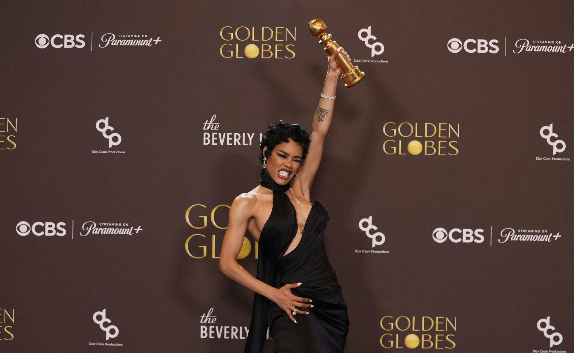 US actress Teyana Taylor poses in the press room with the Best Supporting Actress in a Motion Picture award for "One Battle After Another" during the 83rd annual Golden Globe Awards at the Beverly Hilton hotel in Beverly Hills, California, on January 11, 2026. (Photo by Etienne Laurent / AFP) / -- IMAGE RESTRICTED TO EDITORIAL USE - STRICTLY NO COMMERCIAL USE --