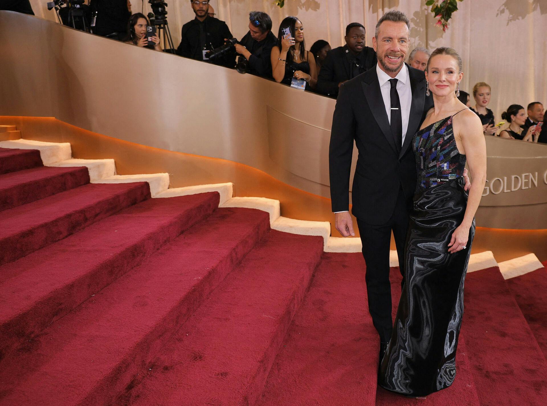 Kristen Bell and Dax Shepard pose on the red carpet at the 83rd Annual Golden Globes in Beverly Hills, California, U.S., January 11, 2026. REUTERS/Mike Blake
