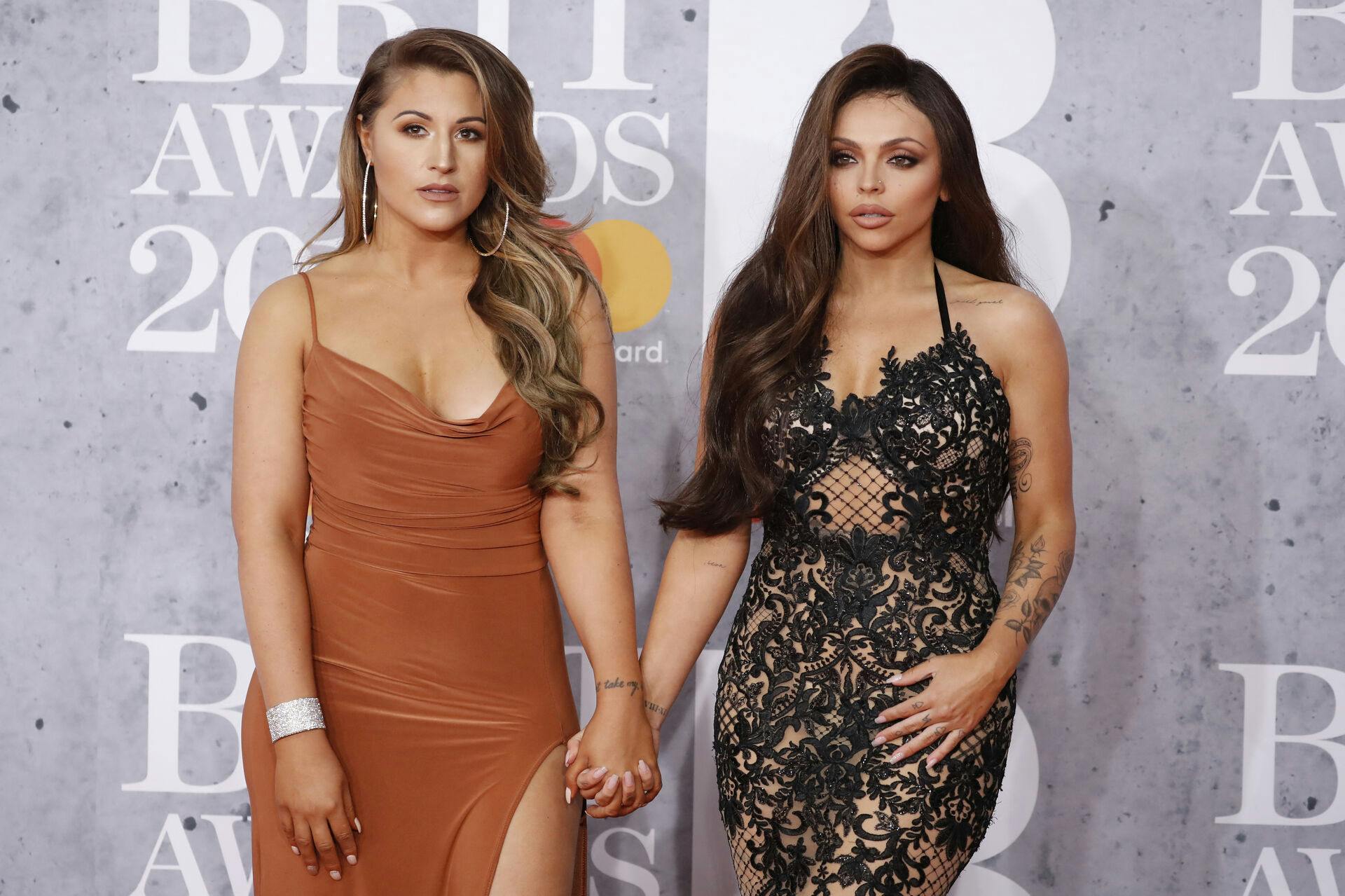 British girl group 'Little Mix' member, Jesy Nelson (R) and friend pose on the red carpet on arrival for the BRIT Awards 2019 in London on February 20, 2019. Tolga AKMEN / AFP