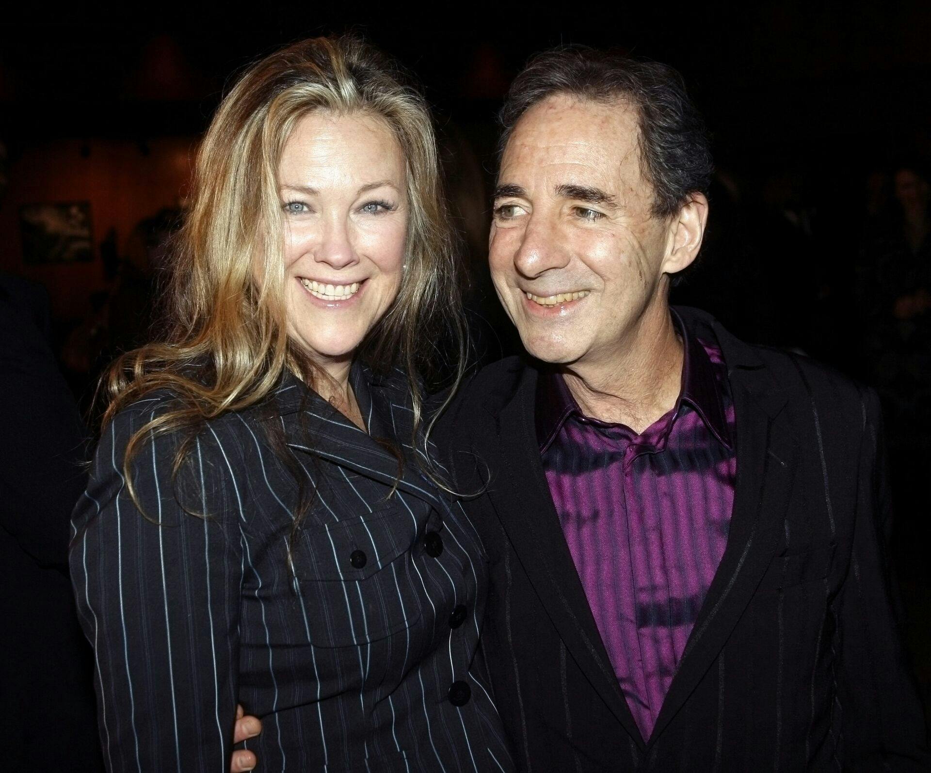Actors Catherine O'Hara (L) and Harry Shearer, two of the cast members of the new comedy film'For Your Consideration,' pose at the film's premiere in Los Angeles, California November 13, 2006. The film, written and directed by Christopher Guest, is about three actors who learn their performances in a film are generating award-season buzz. REUTERS/Fred Prouser (UNITED STATES)