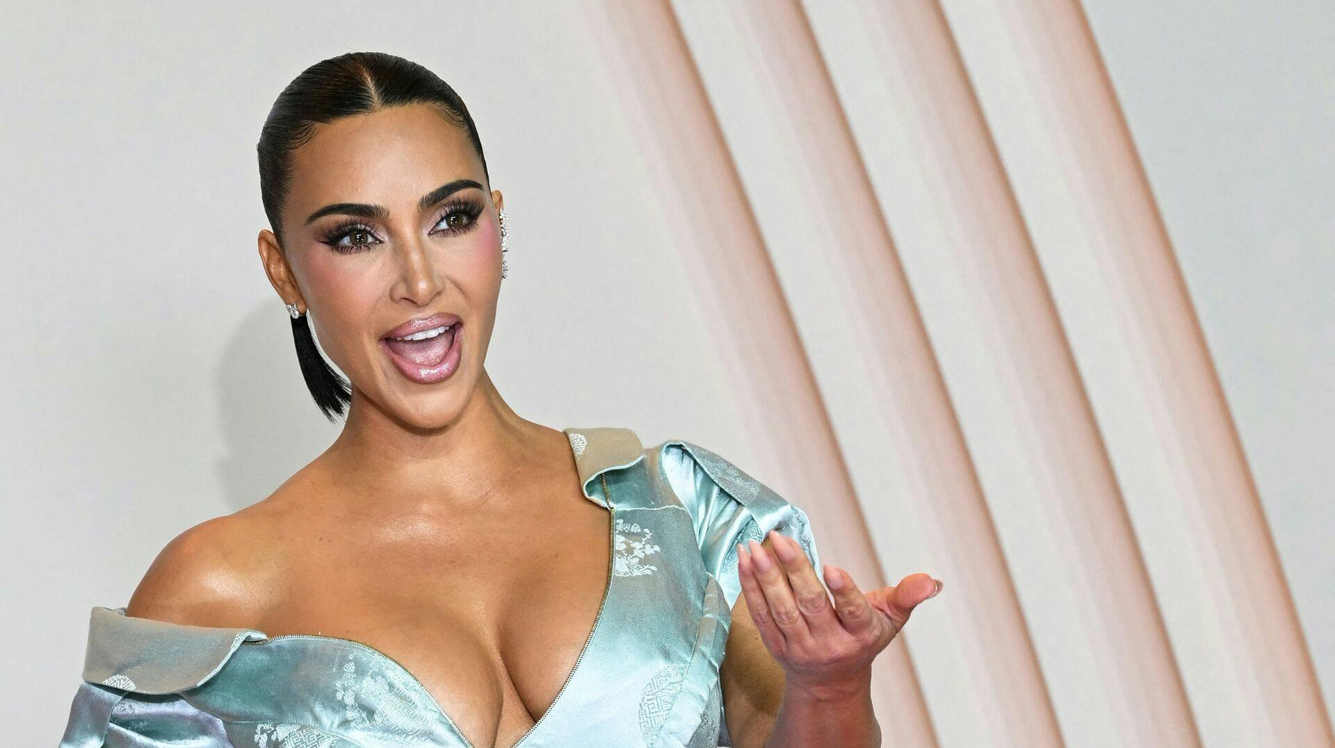 TOPSHOT - US reality TV personality Kim Kardashian poses during a photocall for the premiere of "All's Fair" TV series in Paris on October 21, 2025. (Photo by Bertrand GUAY / AFP)