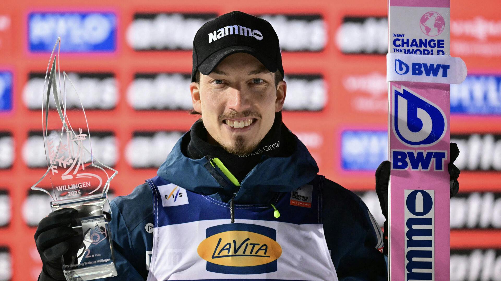 Second placed Norway's Johann Andre Forfang cheers on the podium of the Men's Large Hill Individual competition at the FIS Ski Jumping World Cup in Willingen, western Germany, on February 2, 2025. INA FASSBENDER / AFP