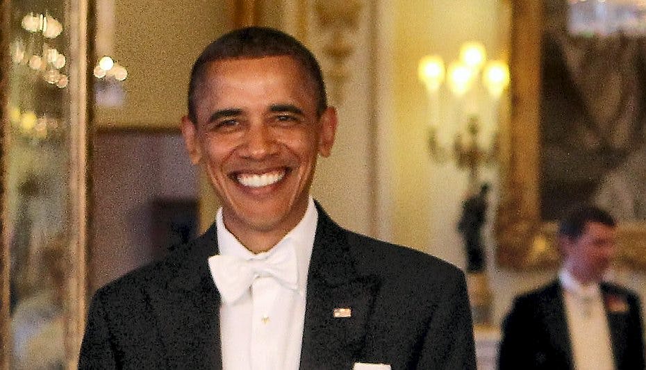 Her ses Obama til en anden, mere formel, begivenhed, men stadig med et stort smil på læben