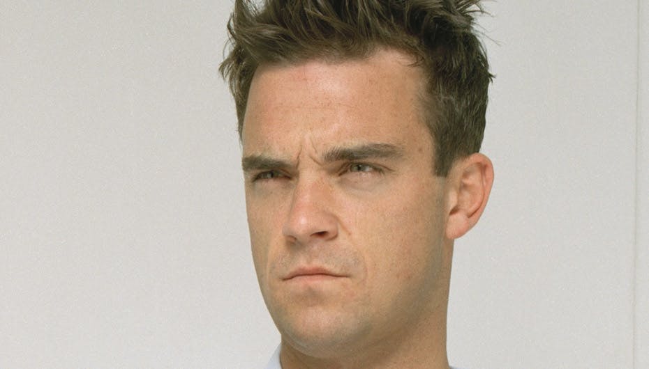 Robbie demonstrerer det ansigtsudtryk, som de fleste mænd ville komme med, hvis de skulle flytte sammen med deres svigermor – bare ikke Robbie selv